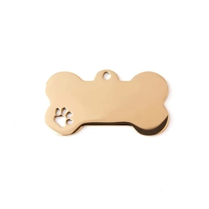 Polished gold bone-shaped pet ID tag with hollow paw detail and mirror finish surface
