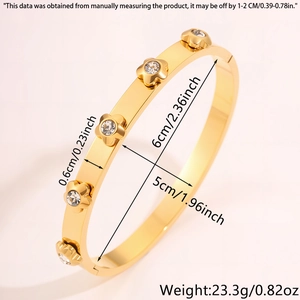 Detailed dimensions of gold stainless steel bangle with floral accents and crystals