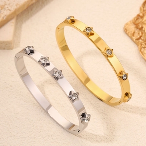 Star-patterned stainless steel bangles with clear rhinestones in gold and silver finish