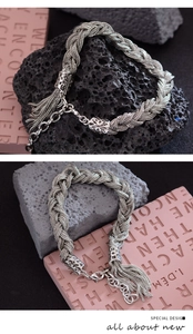 Vue détaillée d'un bracelet tissé argenté avec des franges et ornements métalliques