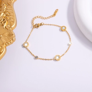 Elegant 18K gold-plated stainless steel Roman bracelet with white crystal pendants