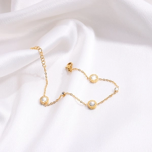 Elegant 18K gold-plated stainless steel bracelet with Roman numeral rings and clear crystals