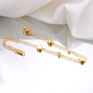 Luxury 18K gold-plated stainless steel bracelet with Roman numeral charms and zircon stones