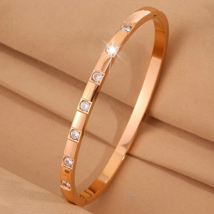 Detailed side view of rose gold titanium steel bracelet with seven sparkling zircons