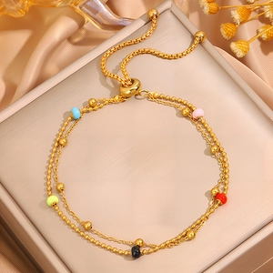 Double-layered gold titanium steel bracelet with colorful beads and adjustable slide clasp