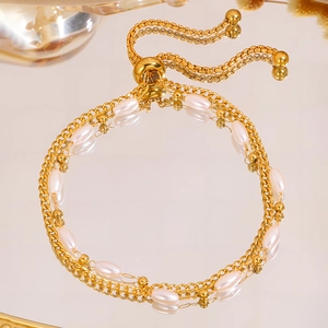 Double-layered stainless steel pearl bracelet with adjustable golden slider clasp