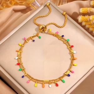 Double-layered gold stainless steel bracelet with colorful teardrop charms and slide clasp