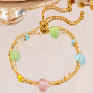 Double-layered gold titanium bracelet with colorful heart beads and adjustable slider clasp