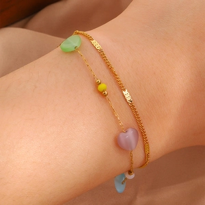 Double-layer titanium steel bracelet featuring colorful heart beads and gold Cuban chain