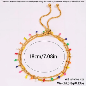 Detail of adjustable gold double chain bracelet with colorful bulb charms and bead slider