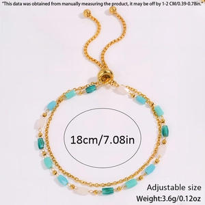 Detailed view of double-layer beaded bracelet with emerald stones and 18K gold plating