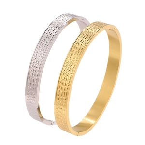 Bracciali rigidi in acciaio al titanio lucido con trama a coccodrillo in oro e argento