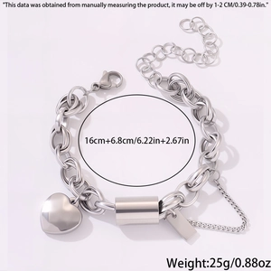 Detail of stainless steel heart pendant bracelet with length measurements and lobster clasp