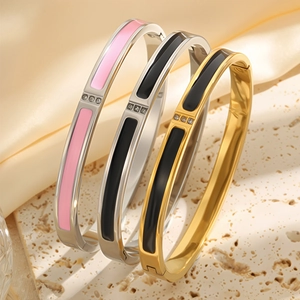 Three 18k gold plated stainless steel bangles with enamel inlay and three small diamonds