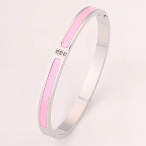 Detail of pink enamel stainless steel bangle featuring three inlaid crystal rhinestones