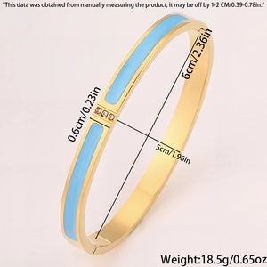 Detail showing 0.6cm width and 5cm-6cm diameter of the gold blue enamel bangle