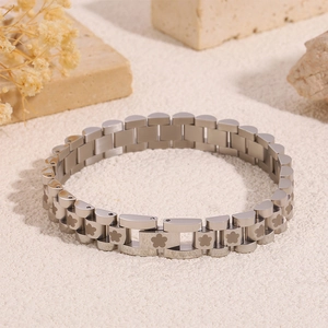Close-up of silver titanium steel watchband bracelet with engraved flower patterns