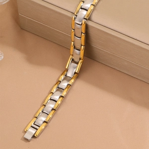 Men's two-tone magnetic stainless steel bracelet with silver and gold textured links
