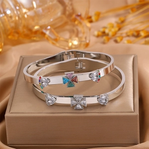 Detailed close-up of tree of life flower bracelets with colorful crystals on a gold jewelry box