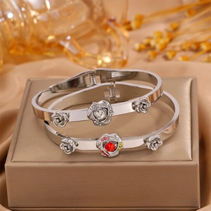Silver tree of life flower bangles with red crystal accents and spring buckle