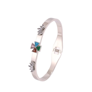 Polished silver stainless steel bangle featuring colorful crystal tree of life flower motifs