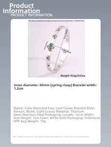Detail view of four-leaf clover stainless steel bangle with colorful crystals and dimensions