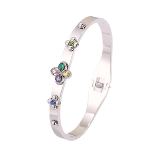 Silver stainless steel hinge bangle featuring a colorful clover of teardrop gemstones