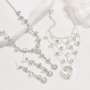 Detail view of silver bridal jewelry set with sparkling rhinestones and hand chain