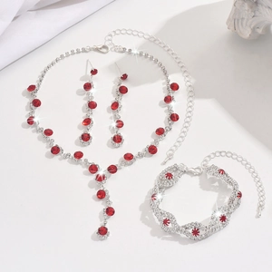 Elegant silver jewelry set with red gemstones including necklace, bracelet and earrings