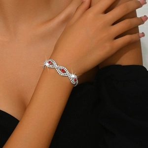 Women's luxury silver bracelet with red round gemstones and sparkling zircon wave pattern