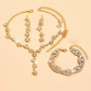 Sparkling gold bridal jewelry set with crystal fringe necklace and matching accessories