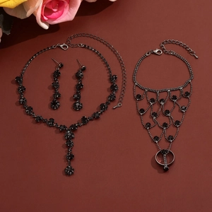 Close-up of black rhinestone fringe necklace and matching gothic jewelry set details