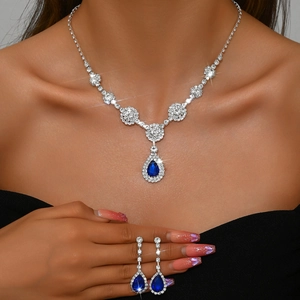 Luxurious silver jewelry set with water drop blue gems and sparkling white zircons