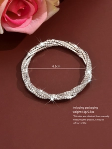 Detailed view of silver-plated rhinestone bracelet with 6.5cm diameter and elegant packaging