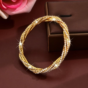 Luxurious multi-layer gold-plated bracelet with pavé-set crystals and twisted design