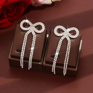 Sparkling silver bow knot long tassel earrings with pavé rhinestones for women