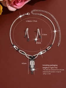 Detailed dimensions of silver necklace and earring set with black teardrop rhinestones