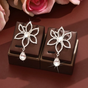 Elegant silver flower drop earrings with clear rhinestones and pear-shaped crystals