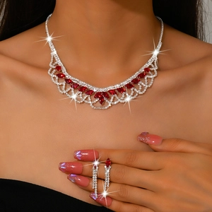 Elegant silver V-shaped necklace with red marquise stones and matching tassel earrings