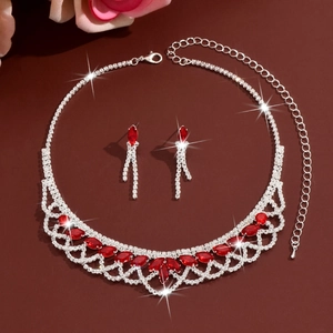 Close-up of luxury red marquise-cut ruby jewelry set with tassel necklace and earrings