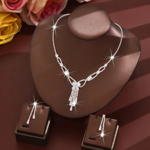 Elegant rhinestone jewelry set featuring butterfly pendant necklace and tassel earrings