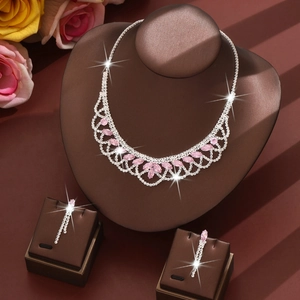 Elegant silver jewelry set with pink stones and sparkling tassels for formal attire