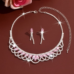 Detail of silver tassel necklace and pink marquise crystal earrings set with lace design