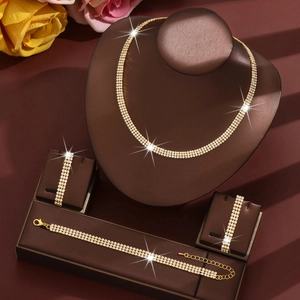 Elegant gold necklace and earring jewelry set with three rows of sparkling crystals