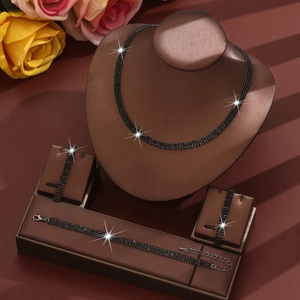 Elegant jewelry set with black rhinestones necklace and bracelets on display stands