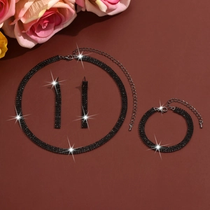 Macro shot of black rhinestone wedding jewelry set with necklace, bracelet and earrings