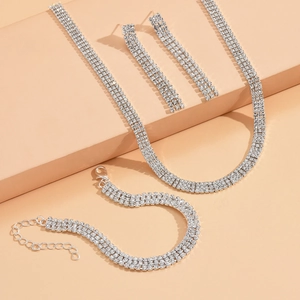 Elegant silver-plated bridal jewelry set with four-row rhinestone choker, bracelet, and earrings