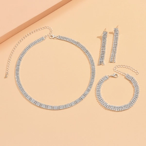Elegant 4-piece silver bridal jewelry set with sparkling rhinestone necklace and earrings