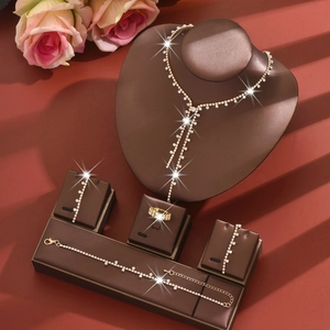 Elegant rhinestone jewelry set with long tassel necklace, bracelet, earrings and ring