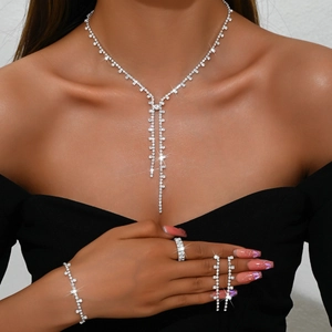 Elegant silver bridal jewelry set with sparkling rhinestones, necklace, bracelet and earrings